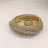 Bracciale rigido dal design originale Dazzdelic con zirconi cubici di lusso alla moda con set di anelli per appuntamenti e feste per donne