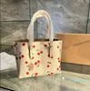 Bolsos de diseñador Bolsos de cereza Bolsos de diseñador Bolso de mujer Bolso de hombro Estampado de flores Bolso de compras de moda para mujer Crossbody