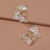 Pendientes de tuerca de estilo coreano para mujeres y niñas, joyería de moda con forma de círculo Simple y dulce, pétalos transparentes que desprenden luz de Color