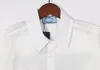 23 Camisa de diseñador para hombre Solapa Triángulo de moda Placa forrada de algodón Patrón de dibujos animados Impreso Camiseta de manga corta informal Top M-2XL