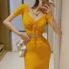 Tweedelige jurk slanke dames sexy oranje drawstring t -shirt v korte mouw top zomer katoenen spleet asymmetrische rok sets wild 230509