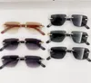 Nya modedesign män och kvinnor pilot solglasögon 0275s Rimless Frame Cut Lens Enkel och populär stil utomhus UV400 -skyddsglasögon