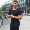 Męskie garnitury B6078 Muscleguys Merk 2023 Nieuwe moda solidna zerwana koszulka Heren Hip Hop Verlengen Mannen Vernietigen Gat Katoen