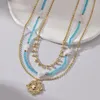 Ketten ANEEBAYH Bohemian Mutilayered Blaue Kristallkette Edelstahlperlen Geometrische Anhänger Halsketten Goldfarbe Charm Chic Schmuck