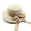 Ny sommar Flat Brimmed Straw Hat Women's Japanese and Korean Bowtie Ribbon Straw Sticked Flat Top Sun Hat Clothing Accessories Beach Hat