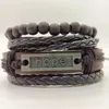 Strand Mode 4 teile/satz Perlen Kreuz Feder Gitar Charme Echtes Leder Männer Armbänder Für Frauen Homme Femme Männlich Weiblich Schmuck