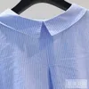 女性のブラウスライトブルー垂直ストライプコットンシャツ女性2023スプリングデザインセンスウエスト閉じた長袖小さな新鮮なルーズトップメス