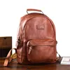 Backpack de alta qualidade de couro genuíno de couro genuíno masculino simples de luto de luto de laptop de viagem de viagem feminina de viagem feminina de couro real