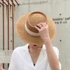 Szerokie brzegowe czapki kobiety tkane słomki pasmowe słoneczne wakacje płaskie filta przeciwsłoneczne plażę