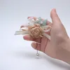 装飾的な花ブートニエールグルーム手首の花の花嫁のブローチウェディングラペルアクセサリービジネスパーティーホリデー用品