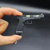 G34 Gun TTI Speed Chasing Shell Ejection Pistole Legierung Miniatur Spielzeug Pistole Schlüsselanhänger Überleben Pistole Modell Abnehmbare Kugel Werfen 2082