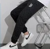 2023 European and American autumn new men's women's thin shark mouth star night light casual pants pants