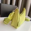 10A Bolso de diseñador Forma de bola de masa hervida clásica Bolso de hombro Triángulo Hoja de metal neutral Bolso inclinado Material de cuero impermeable avanzado Bolso para axilas