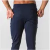 Calças masculinas 2023 Men casual Men da cintura elástica Fitness Running Treinamento calça masculino Male Solid Sortlants Balck Gray Sports Long Pant Long