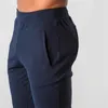 Pantaloni da uomo 2023 Casual Uomo Elastico in vita Fitness Pantaloni da allenamento da corsa Pantaloni sportivi da uomo solidi Balck Grigio Pantaloni lunghi sportivi