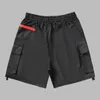 2023 hommes plage short mode classique designer pantalons courts technologie de conception embellie sangle grande poche tissu en nylon all-match conception de matériel importé vers le bas