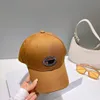 Diseñador Gorras de béisbol Sombrero de cubo Gorra versátil para hombre Mujer Sombreros Clásico Negro Blanco Alta calidad Moda de playa Sombrero de sombrilla de calle al aire libre