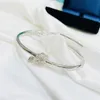 Bracciale di design elegante avvolto con materiale in lega di nodo mezzo incorporato con diamanti signore gioielli unici 3 colori disponibili con scatola