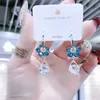 Серваринг -серьги для женщин -девушек с сияющими ювелирными ювелирными украшениями Новые голубые хрустальные цветочные серьги для женщин