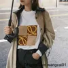 wangcai01女性のTシャツ春と夏2023年新しいハイバージョンブロックカラーコントラストフォーム印刷男性と女性の丸い首のカジュアルショートセヴィングTシャツ