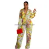 Tweedelige broek voor dames adogirl bloemenprint geplooid Losse tweedelig set 2022 herfstvrouwen afslaan kraag knop met lange mouwen met lange mouwen bovenste wijd been broek T230512