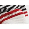 425 2023滑走路夏夏の同じスタイルのセーターショートスリーブカーディガンラペルネックホワイトブラックファッション服高品質レディースDL