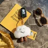 Keychains Fluffy Real Rex Fur Keychain zachte glimlachende witte kleine wolken hanger vrouwen tas hangende speelgoed auto metalen sleutelring ornamenten