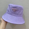 chapeau seau chapeau seau design Triangle logo tissu acrylique imperméable crème solaire chapeau de pêcheur dans une variété de couleurs