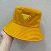 kova şapka tasarımcısı kova şapka üçgen logo akrilik kumaş su geçirmez güneş kremi balıkçı şapkası çeşitli renklerde
