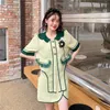 Kurtki damskie Dwuczęściowe zestawy Summer vintage francuski falbany kołnierz kwiatowy koszulka z rękawem w wysokim talii Pół A-line mini spódnica kurtka