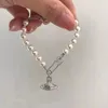 Braccialetto di perle a graffetta Love Chain Braccialetto di Saturno Design creativo Braccialetto elegante Gioielli da donna