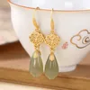 Pendientes colgantes Original Natural Hetian Jade orquídea fresca estilo chino Retro único oro antiguo encanto joyería de plata de las mujeres