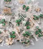Pins Brooches 20 pcs Wholesale Geen Plants Clover Brooches Lapel Pins for Hijab Suit Dress Hat Bags Decoration Jewelry Accessories 230515