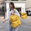 Aufbewahrungstaschen Koreanische große Kapazität Outdoor-Rucksack Jungen Mädchen Einfarbige Schultasche Weibliche Abnutzung Oxford Tuch Student