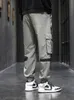 Pantaloni da uomo Primavera Estate Multi-tasche Pantaloni cargo a nastro Uomo Hip Hop Streetwear Pantaloni da jogging neri Pantaloni casual traspiranti maschili 230515