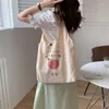 Kvällspåsar 2023 mode duk tygväska plånböcker och handväskor för kvinnor shoppare söt designer axel japansk stil persika tryck eko