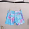Kvinnors shorts Kvinnor Medium midjeljus tvättad slips färgad tasshål denim shorts kvinnlig klippa ut super shorts nattklubb 230512