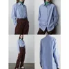 Magliette da donna TheR0w Camicia a righe verticali blu Stile minimalista da donna Colletto in piedi Top fresco Estate 2023