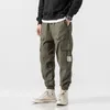 Herrbyxor hiphop boy multi-pocket elastisk midja harem byxor män streetwear punk casual byxor joggar man ankel längd herr byxor 230515