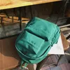 Aufbewahrungstaschen Koreanische große Kapazität Outdoor-Rucksack Jungen Mädchen Einfarbige Schultasche Weibliche Abnutzung Oxford Tuch Student