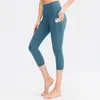 Pantalon actif OEING Capris de yoga taille haute pour femme avec poches contrôle du ventre non transparent à travers les jambières de sport d'entraînement en cours d'exécution