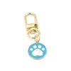 Llaveros Venta al por mayor Dog Paw Print Colgante Llavero Moda Cremallera Pl Charm Planner Charms Accesorios Hangbag Colgantes colgantes Keyri Otfy4