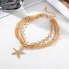 Anklets en guldfärg flerskiktskedja armband på benstjärniga hänge för kvinnor strand anklet smycken bohemisk fot