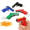 Ny Universal Mini Keychain Car Keychain Toy Gun Shooting Pistol Kid Outdoor Party Folding Metal Gun Present Car Styling Keyring