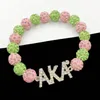 Strand à mão feita de irmandade grega linha elástica linhagem rosa verde bola letra de letra de letra de pulseira jóias femininas