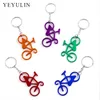 Nova liga aleatória de cor aleatória de cor de cor de bicicleta ensolarada para homens para homens para homens lindas joias de chaveiro de bolsa 10pcs
