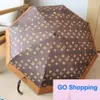 Top European Famous Fashion New Vinyl Sun Protective Sun Umbrella Sunny and Rain Double-Usage Three-Fold Open Wood Handle Gift Umbrella