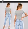 Jeans da donna multicolori da donna con fori strappati design fiori ricamati pantaloni lunghi piedi piccoli streetwear donna