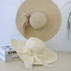 Szerokie brzegowe czapki wiadra Summer Słomowa kapelusz Bowknot Floppy Panama Kobieta na zewnątrz Składana plażowa czapka słoneczna 230517