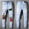 Дизайнерские стеки стекаются джинсы Европейские фиолетовые джинсы для мужских стеганых